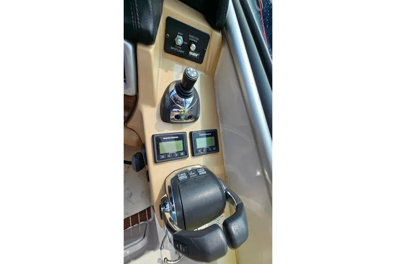 Slide: The Image of Control panel of 2013 Four Winns V335 boat with joystick and digital displays. - 37