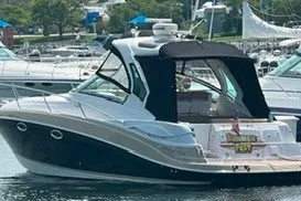 Slide: The Image of 2013 Four Winns V335 boat docked in a marina. - 1