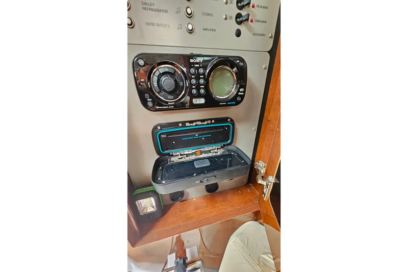 Slide: The Image of Control panel of a 2013 Four Winns V335 boat with Sony stereo system. - 24