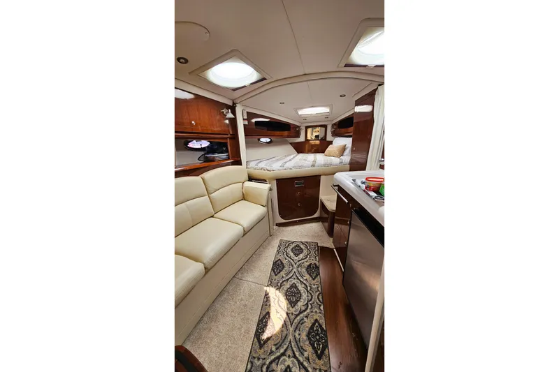 Slide: The Image of Luxurious interior of 2013 Four Winns V335 yacht with cozy seating and elegant decor. - 7