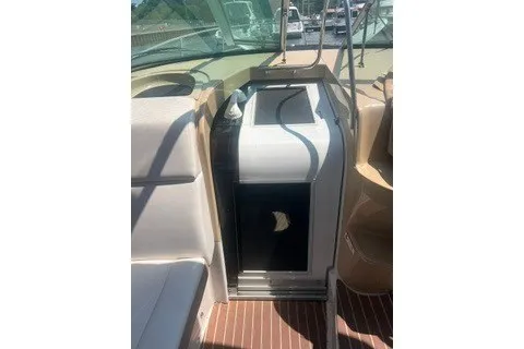 Slide: The Image of 2013 Four Winns V335 boat interior with seating and cabin entrance. - 6
