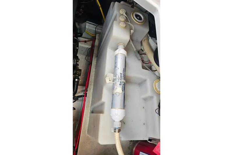 Slide: The Image of 2013 Four Winns V335 boat water filtration system in engine compartment. - 63