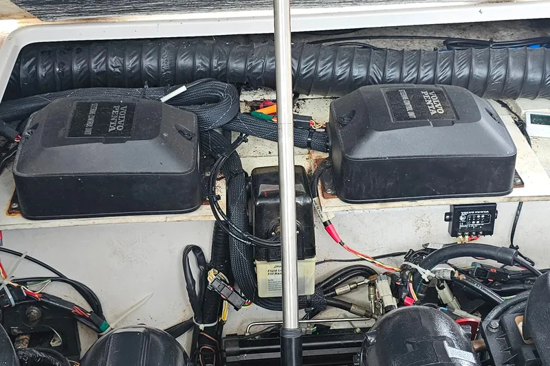 Slide: The Image of Engine compartment of 2013 Four Winns V335 boat with Volvo Penta components. - 64
