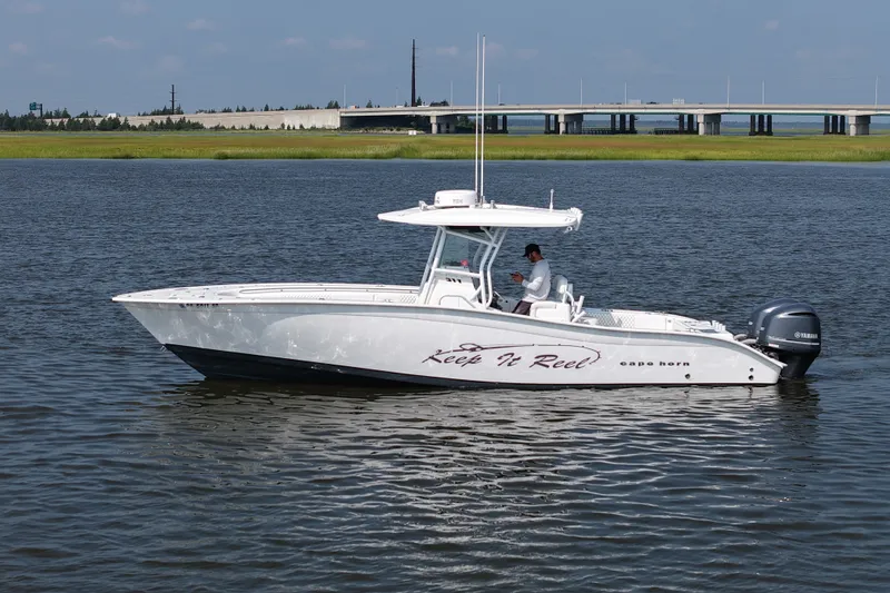 The Image of 2015 Cape Horn 31T boat on water, side view, with bridge in background. - 0