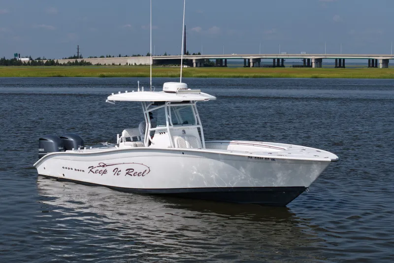 Slide: The Image of 2015 Cape Horn 31T boat on water with bridge in background. - 3