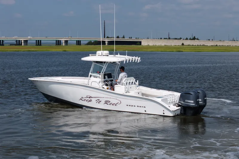 Slide: The Image of 2015 Cape Horn 31T boat cruising on water with Yamaha engines. - 7