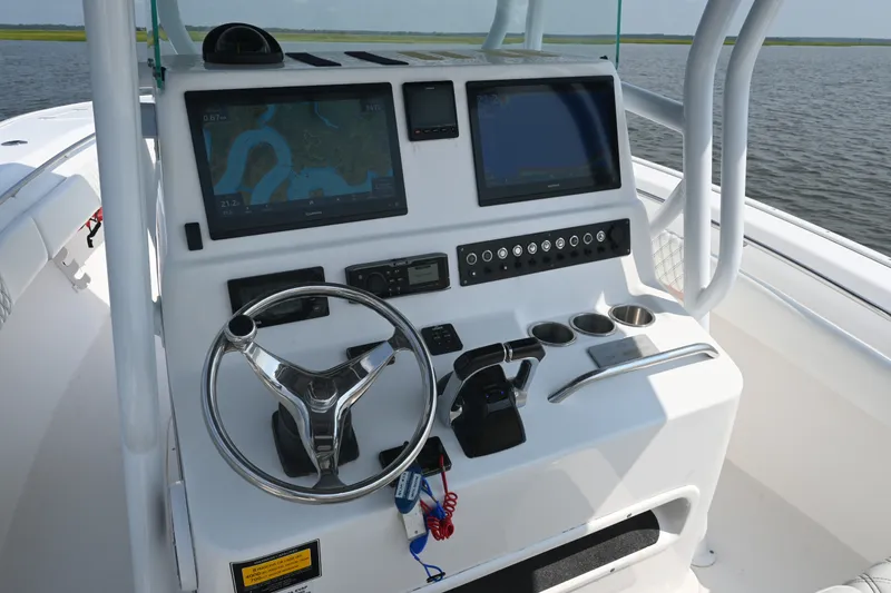 Slide: The Image of Helm of 2015 Cape Horn 31T boat with navigation screens and controls. - 22