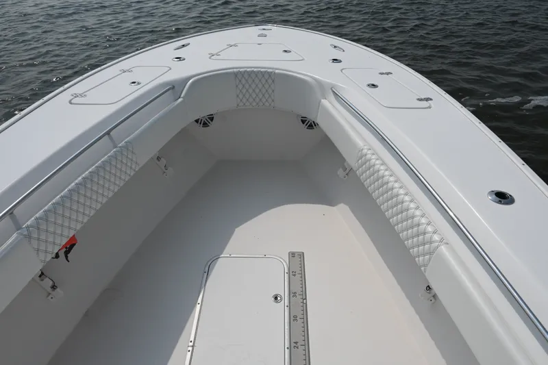Slide: The Image of 2015 Cape Horn 31T boat interior with cushioned seating and storage compartments. - 14