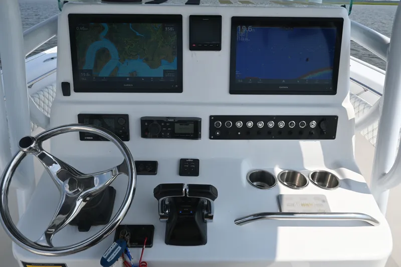Slide: The Image of 2015 Cape Horn 31T boat dashboard with navigation screens and controls. - 23