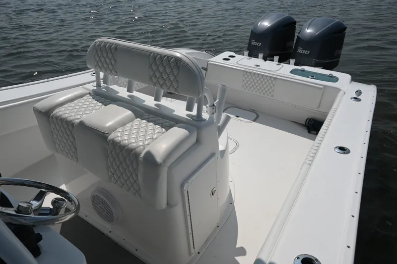 Slide: The Image of 2015 Cape Horn 31T boat interior with dual engines and cushioned seating. - 20