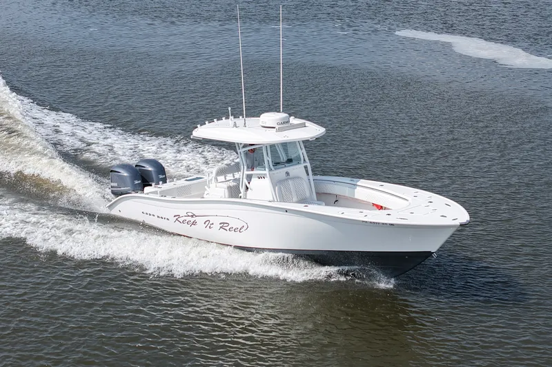 Slide: The Image of 2015 Cape Horn 31T boat cruising on water with twin engines. - 11