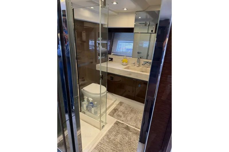 Slide: The Image of Luxurious bathroom in 2023 Prestige 690 yacht with modern fixtures and elegant design. - 28