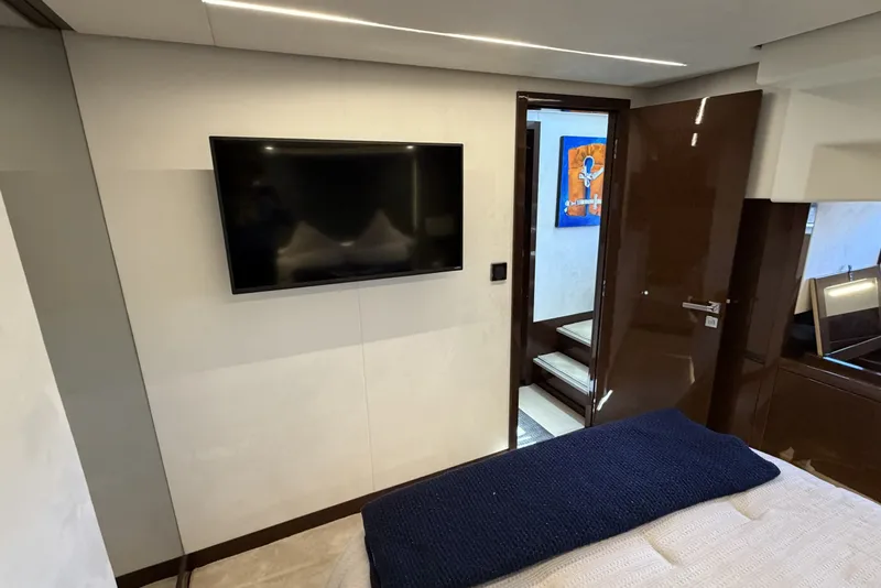 Slide: The Image of Luxurious interior of 2023 Prestige 690 yacht with modern TV and elegant decor. - 33