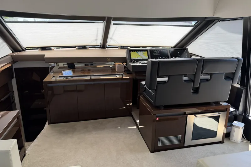 Slide: The Image of Luxurious interior of 2023 Prestige 690 yacht with modern helm and navigation equipment. - 22