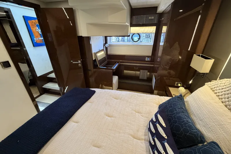 Slide: The Image of Luxurious interior of 2023 Prestige 690 yacht with elegant bedroom and modern decor. - 32