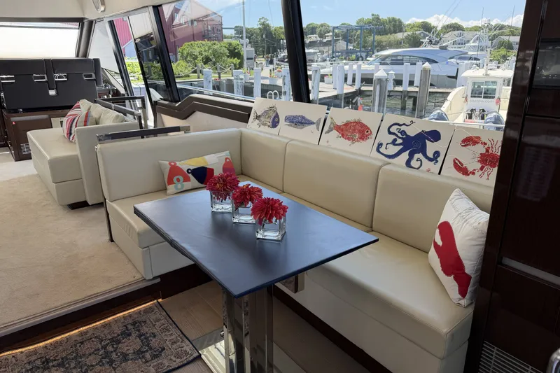 Slide: The Image of Luxurious interior of 2023 Prestige 690 yacht with elegant seating and nautical decor. - 19