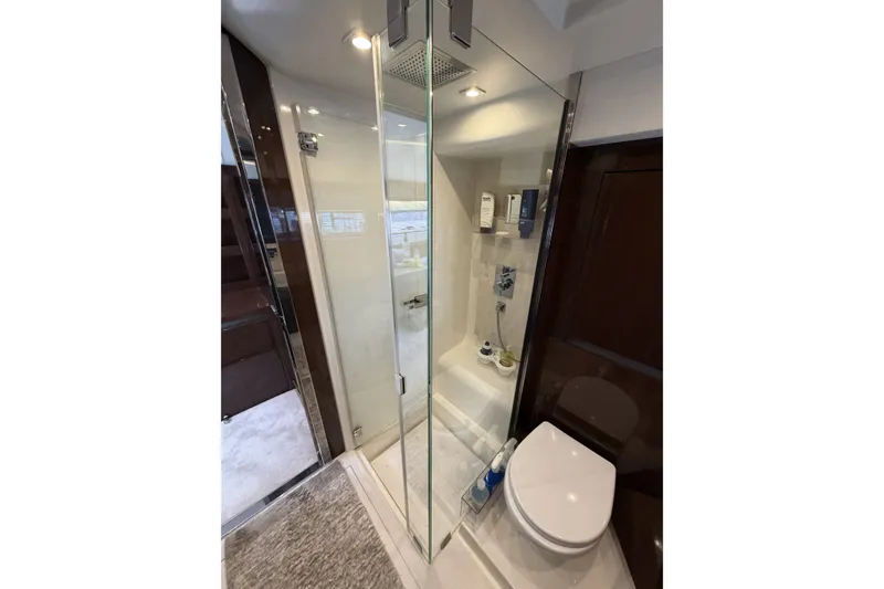 Slide: The Image of Luxurious bathroom in 2023 Prestige 690 yacht with glass shower and modern fixtures. - 30