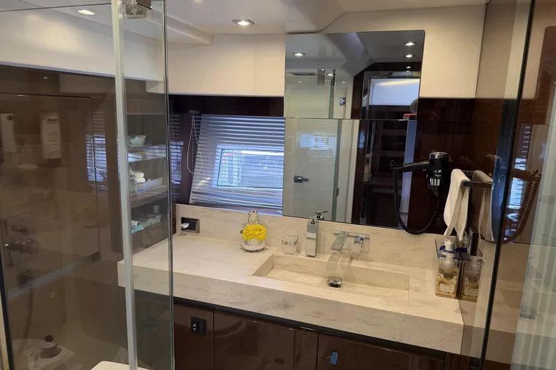 Slide: The Image of Luxurious bathroom in 2023 Prestige 690 yacht with modern fixtures and elegant design. - 29