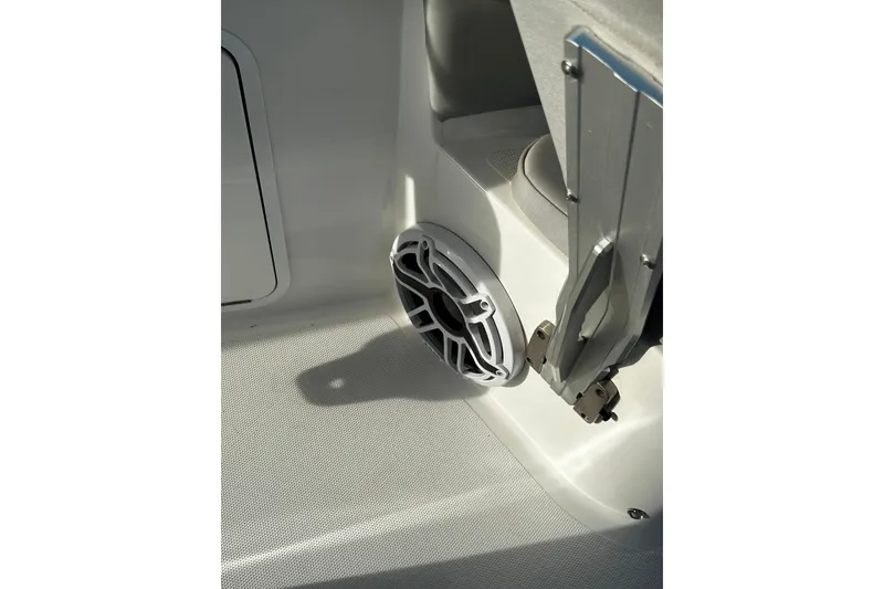 Slide: The Image of 2021 Wellcraft 262 Fisherman boat interior with speaker and metal fittings. - 30