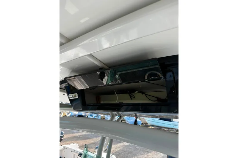Slide: The Image of 2021 Wellcraft 262 Fisherman boat console detail with electronic equipment. - 24