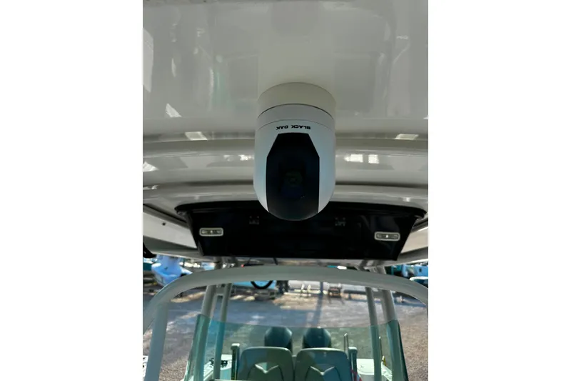 Slide: The Image of 2021 Wellcraft 262 Fisherman boat with mounted Black Oak camera on the ceiling. - 32