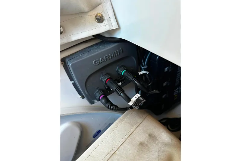 Slide: The Image of Garmin device with cables on 2021 Wellcraft 262 Fisherman boat. - 14