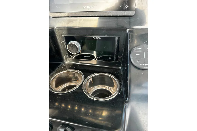 Slide: The Image of 2021 Wellcraft 262 Fisherman dashboard with Fusion stereo and cup holders. - 16