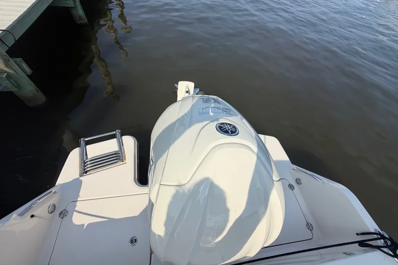 Slide: The Image of 2025 Grady-White Freedom 235 boat with Yamaha outboard engine at dockside. - 37