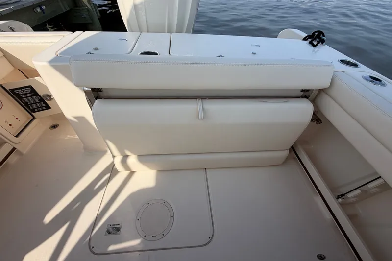 Slide: The Image of 2025 Grady-White Freedom 235 boat interior with foldable seating and storage. - 30