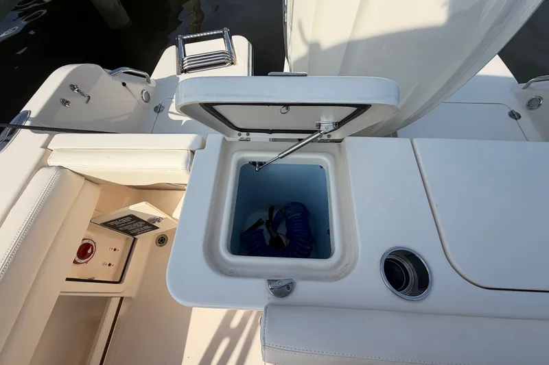 Slide: The Image of Open storage compartment on 2025 Grady-White Freedom 235 boat deck. - 33