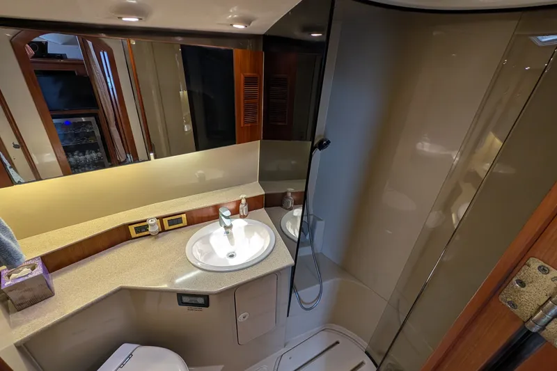 Slide: The Image of Luxurious bathroom in a 2005 Rampage 38 Express yacht with modern fixtures. - 28