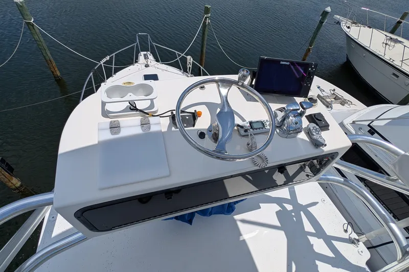 Slide: The Image of Helm of 2005 Rampage 38 Express boat with steering wheel and navigation equipment. - 9
