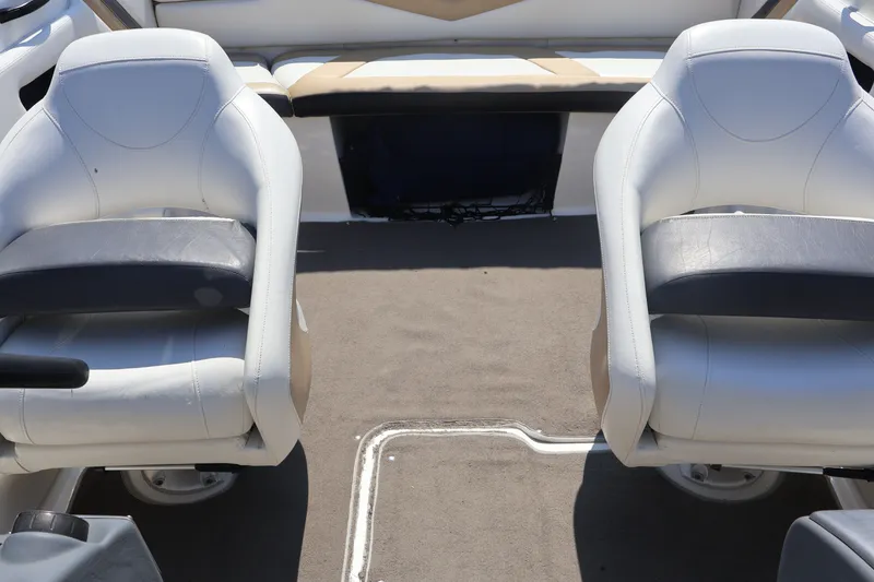 Slide: The Image of Interior of 2012 Larson LX 2150 boat with two white captain's chairs. - 33