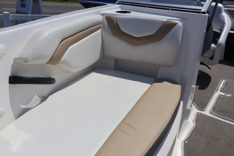 Slide: The Image of 2012 Larson LX 2150 boat interior with beige and white seating. - 38