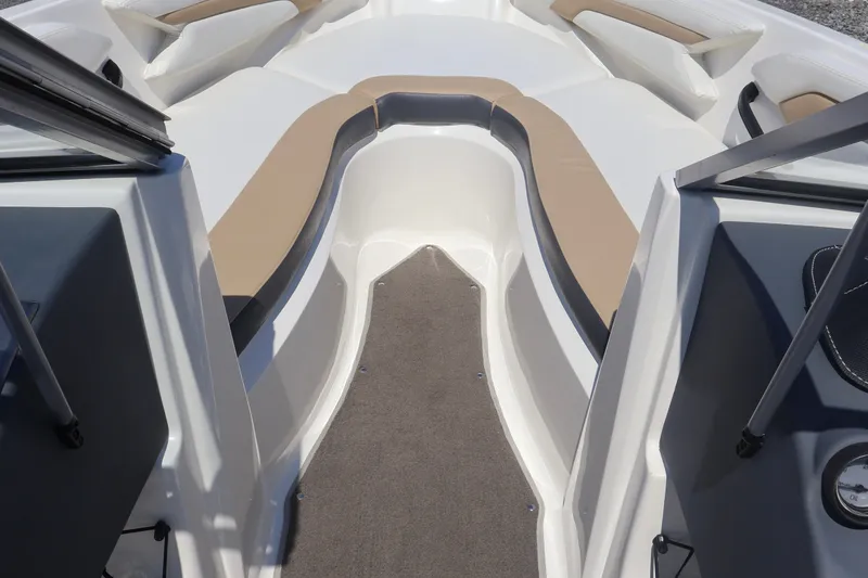 Slide: The Image of Interior view of a 2012 Larson LX 2150 boat, featuring beige and white seating. - 34