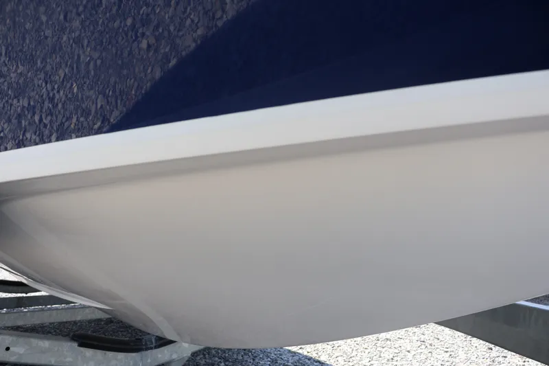 Slide: The Image of Close-up of a 2012 Larson LX 2150 boat hull on a trailer. - 4