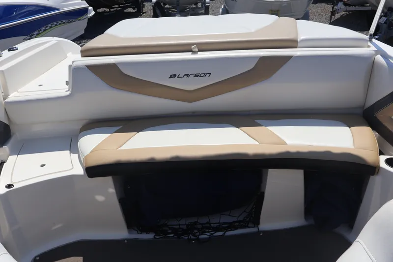 Slide: The Image of 2012 Larson LX 2150 boat interior with beige and white seating. - 18