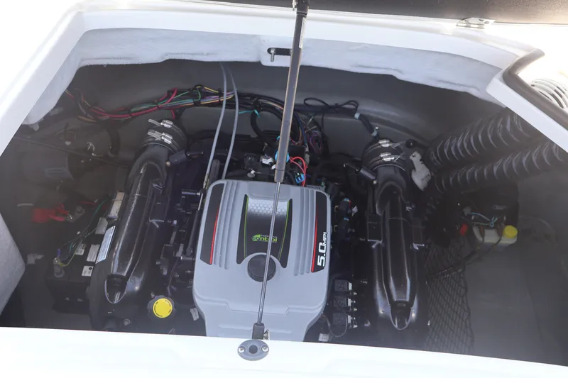 Slide: The Image of Engine compartment of a 2012 Larson LX 2150 boat, showcasing a 5.0 MPI engine. - 20