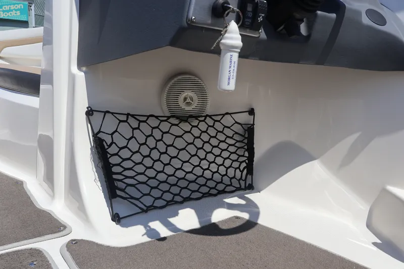 Slide: The Image of Interior of 2012 Larson LX 2150 boat with net storage and speaker. - 30