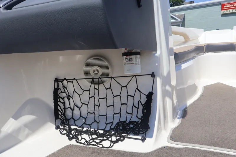 Slide: The Image of Interior of 2012 Larson LX 2150 boat with net storage and speaker. - 28