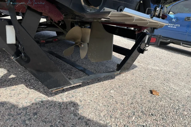 Slide: The Image of 2011 MasterCraft X-35 boat propeller and trailer on gravel surface. - 6