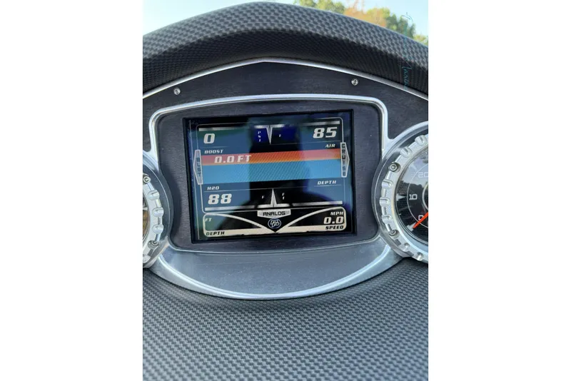 Slide: The Image of Dashboard of 2011 MasterCraft X-35 boat showing digital gauges and speedometer. - 44