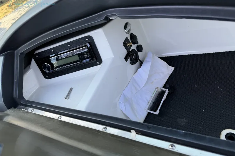 Slide: The Image of Interior of a 2011 MasterCraft X-35 boat showing a JVC stereo system. - 37