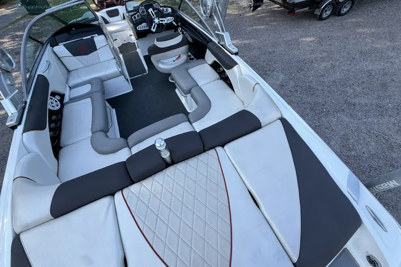 Slide: The Image of 2011 MasterCraft X-35 boat interior with spacious seating and modern design. - 13