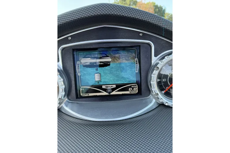 Slide: The Image of Dashboard of a 2011 MasterCraft X-35 boat with digital display and speedometer. - 43