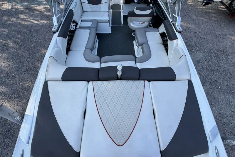 Slide: The Image of 2011 MasterCraft X-35 boat interior with spacious seating and modern design. - 12
