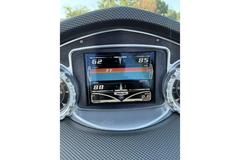Slide: The Image of Dashboard of a 2011 MasterCraft X-35 boat showing fuel, air, and water data. - 39