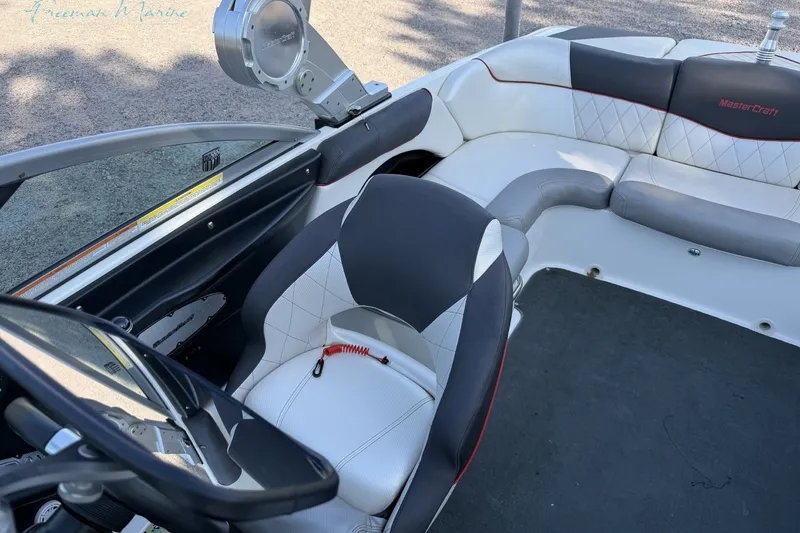 Slide: The Image of Interior of a 2011 MasterCraft X-35 boat with sleek seating and modern design. - 32