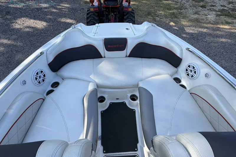 Slide: The Image of Interior of a 2011 MasterCraft X-35 boat with white and gray seating. - 24