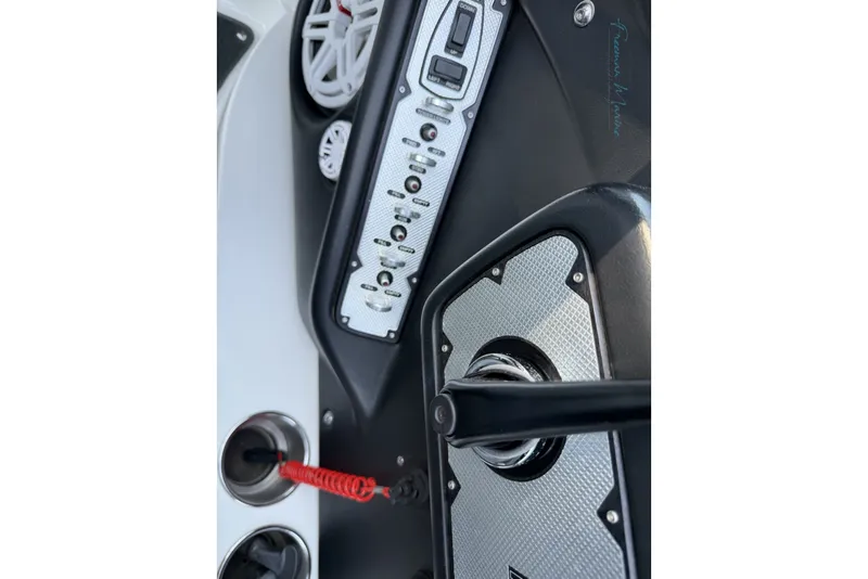 Slide: The Image of 2011 MasterCraft X-35 boat dashboard with control panel and speakers. - 48